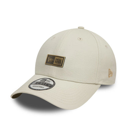 This is a New Era Badge Cream 9FORTY Adjustable Cap 1