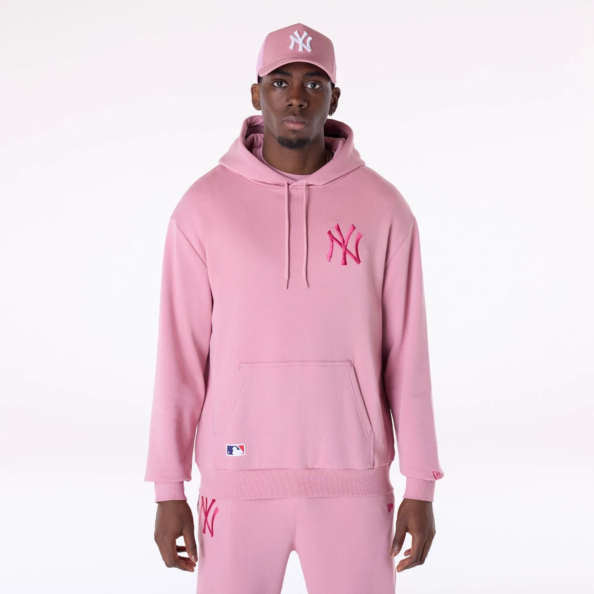 The Male model is wearing New York Yankees MLB League Essential Dark Pink Oversized Pullover Hoodie 1