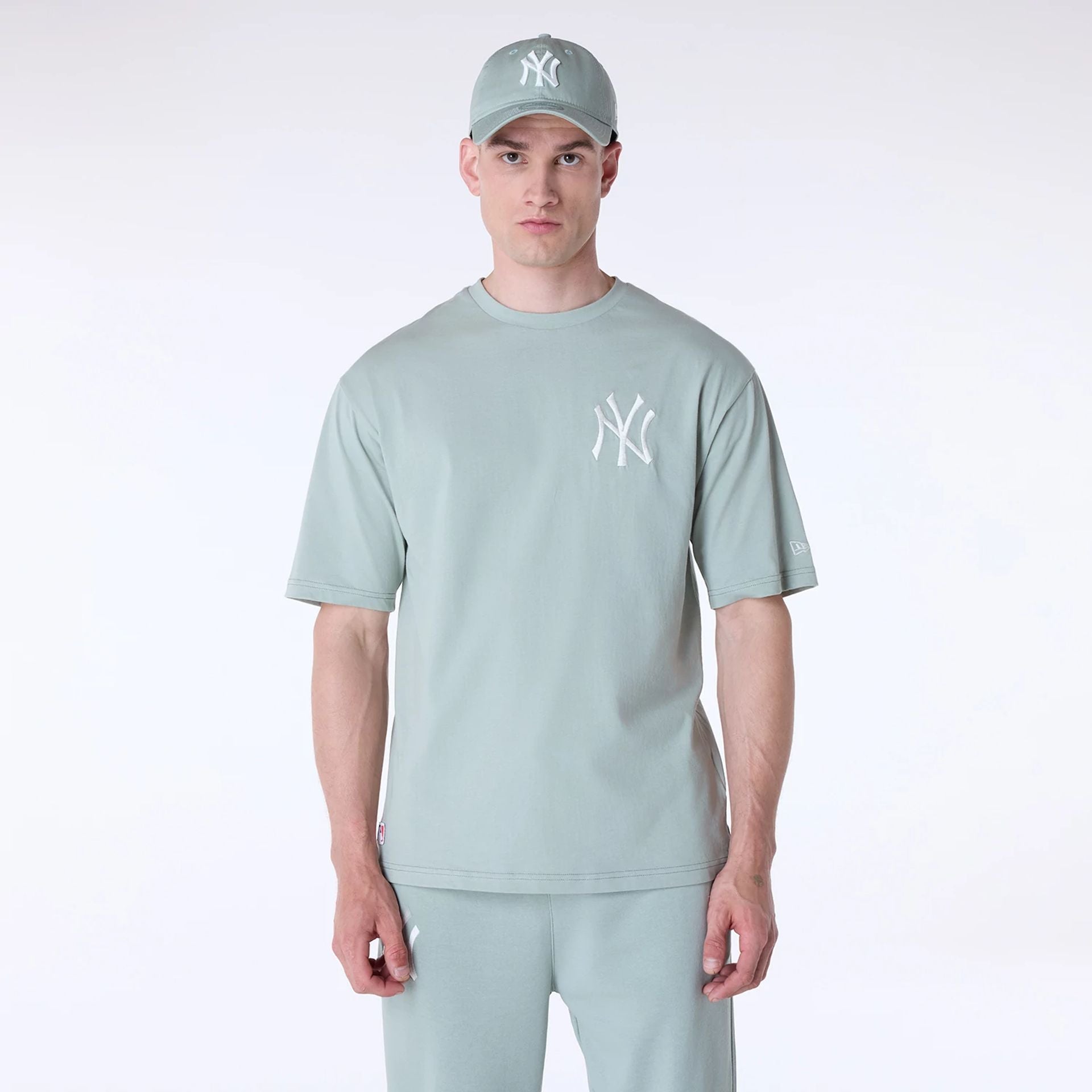 The Male model is wearing New York Yankees MLB League Essential Pastel Green Oversized T-Shirt 1