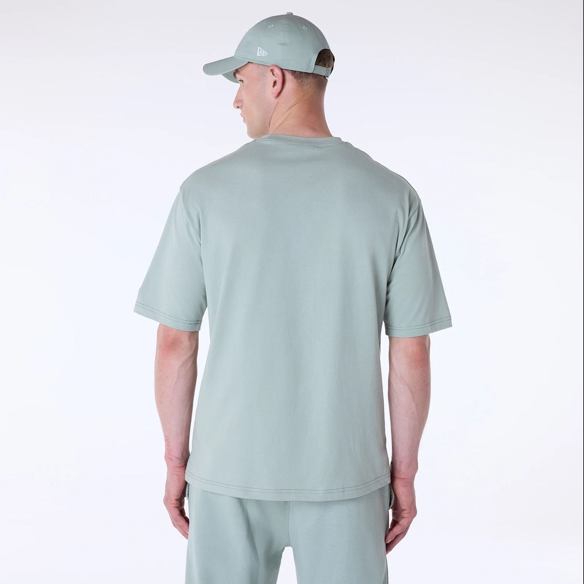 The Male model is wearing New York Yankees MLB League Essential Pastel Green Oversized T-Shirt 2