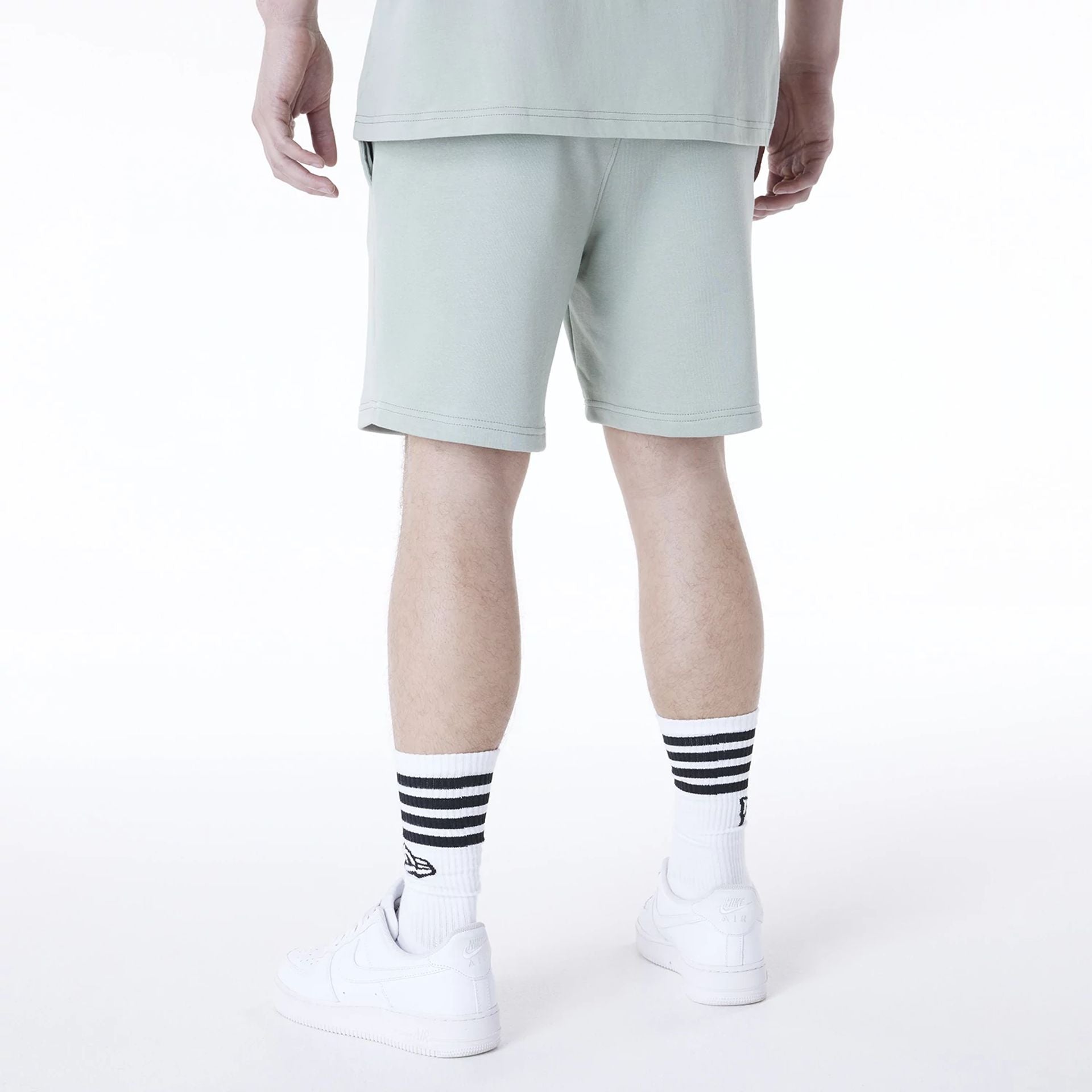 The Male model is wearing New York Yankees MLB League Essential Pastel Green Shorts 2