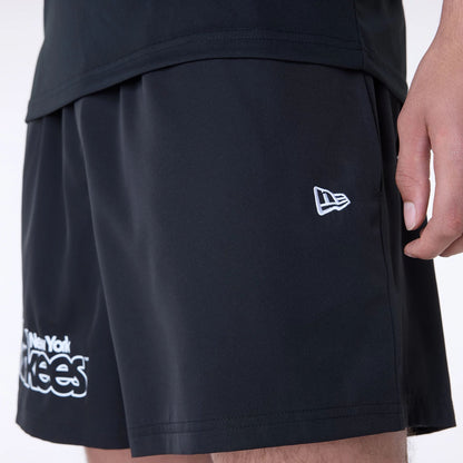 The Male model is wearing New York Yankees MLB Essentials Black Shorts 7