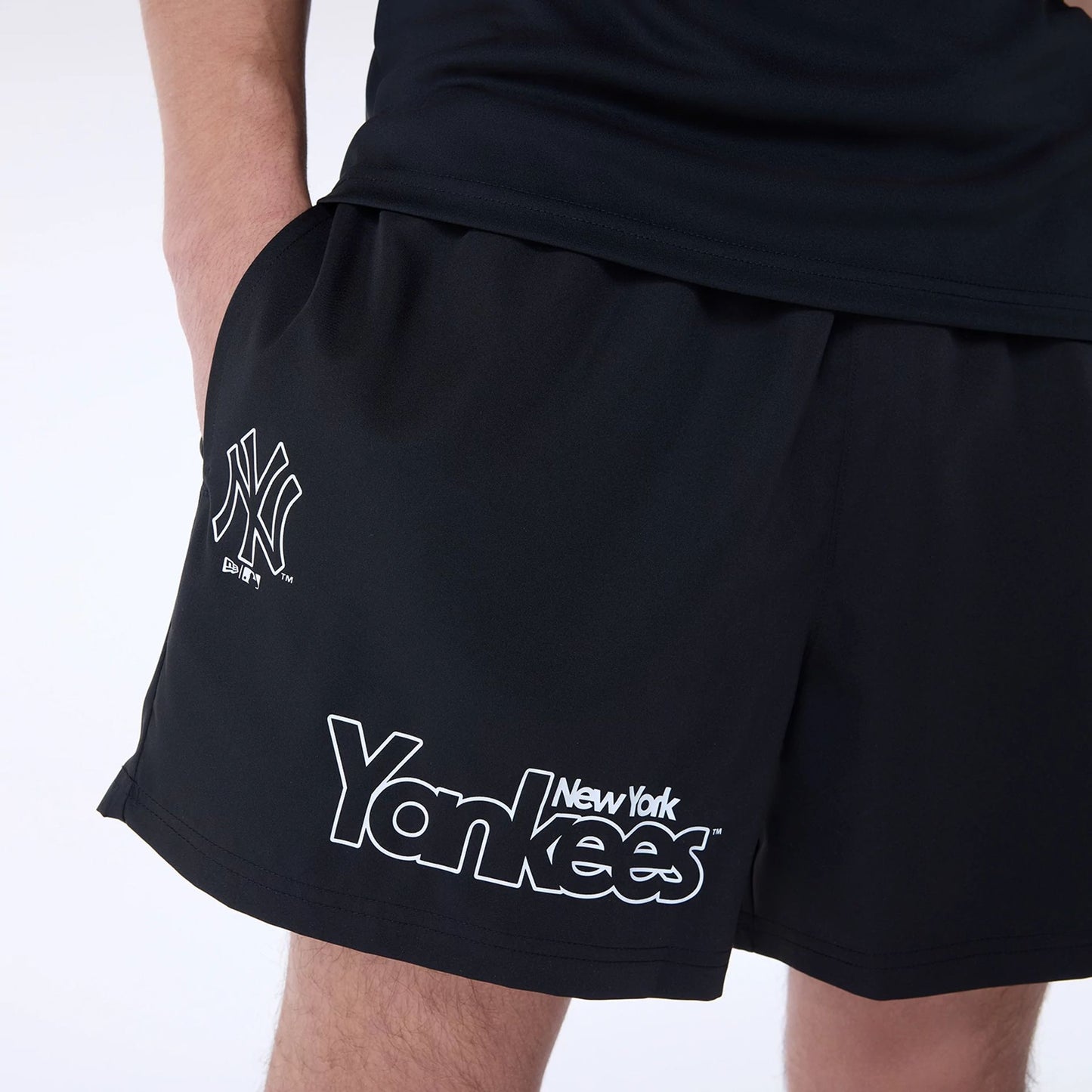 The Male model is wearing New York Yankees MLB Essentials Black Shorts 5