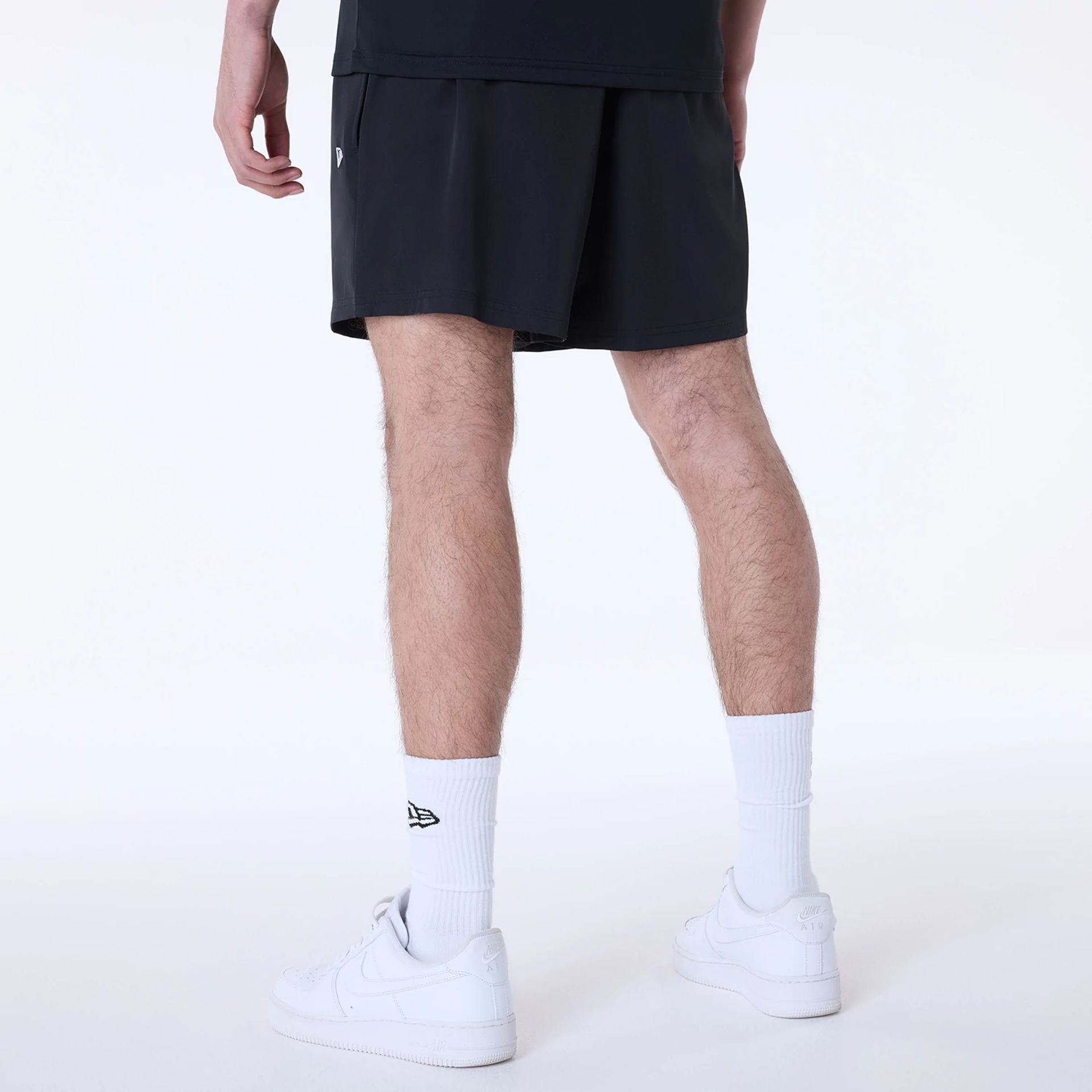 The Male model is wearing New York Yankees MLB Essentials Black Shorts 2