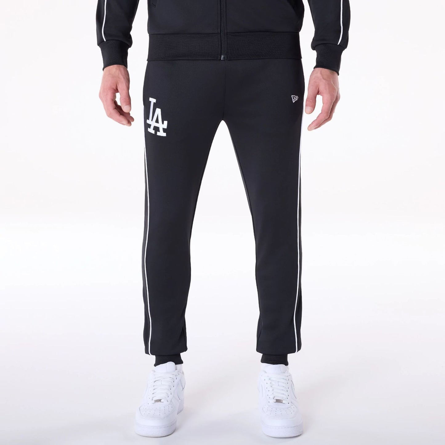 The Male model is wearing LA Dodgers MLB Track Pants Black Fleece Joggers 1