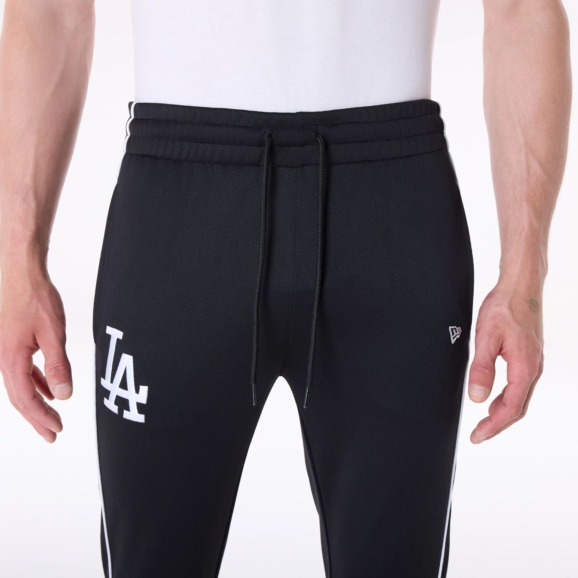 The Male model is wearing LA Dodgers MLB Track Pants Black Fleece Joggers 3