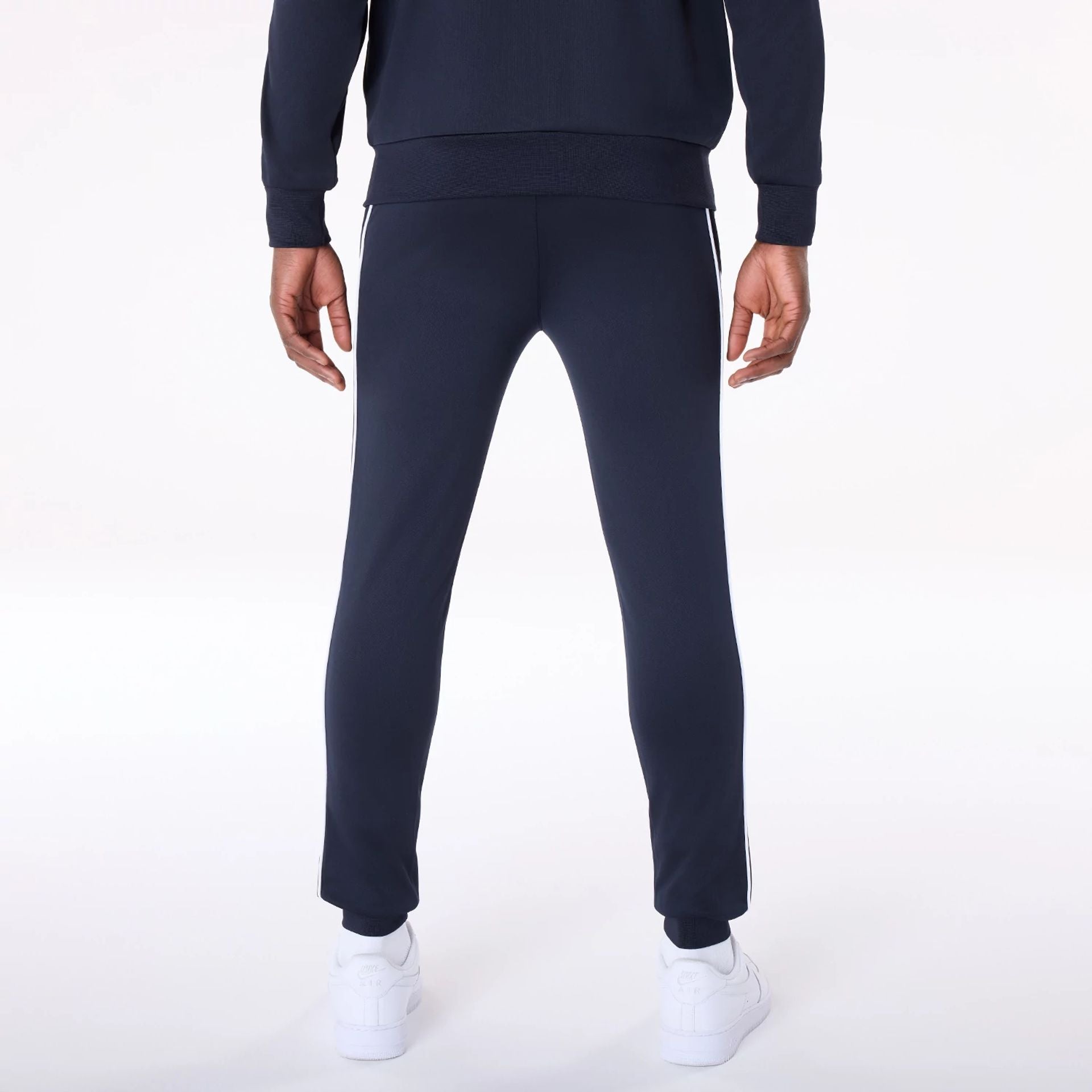 The Male model is wearing New York Yankees MLB Track Pants Navy Fleece Joggers 2