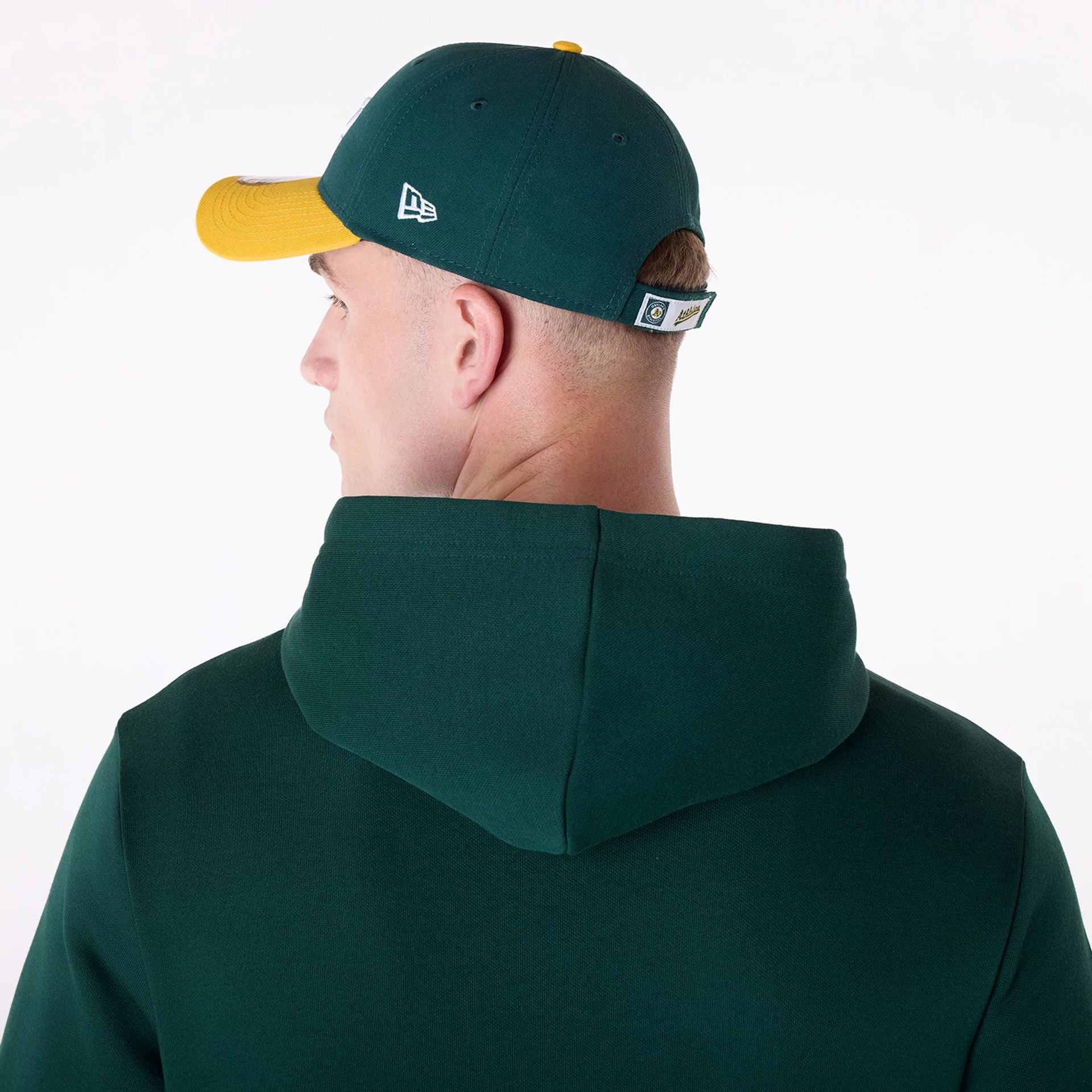 The Male model is wearing Oakland Athletics MLB Pennant Graphic Dark Green Pullover Hoodie 4