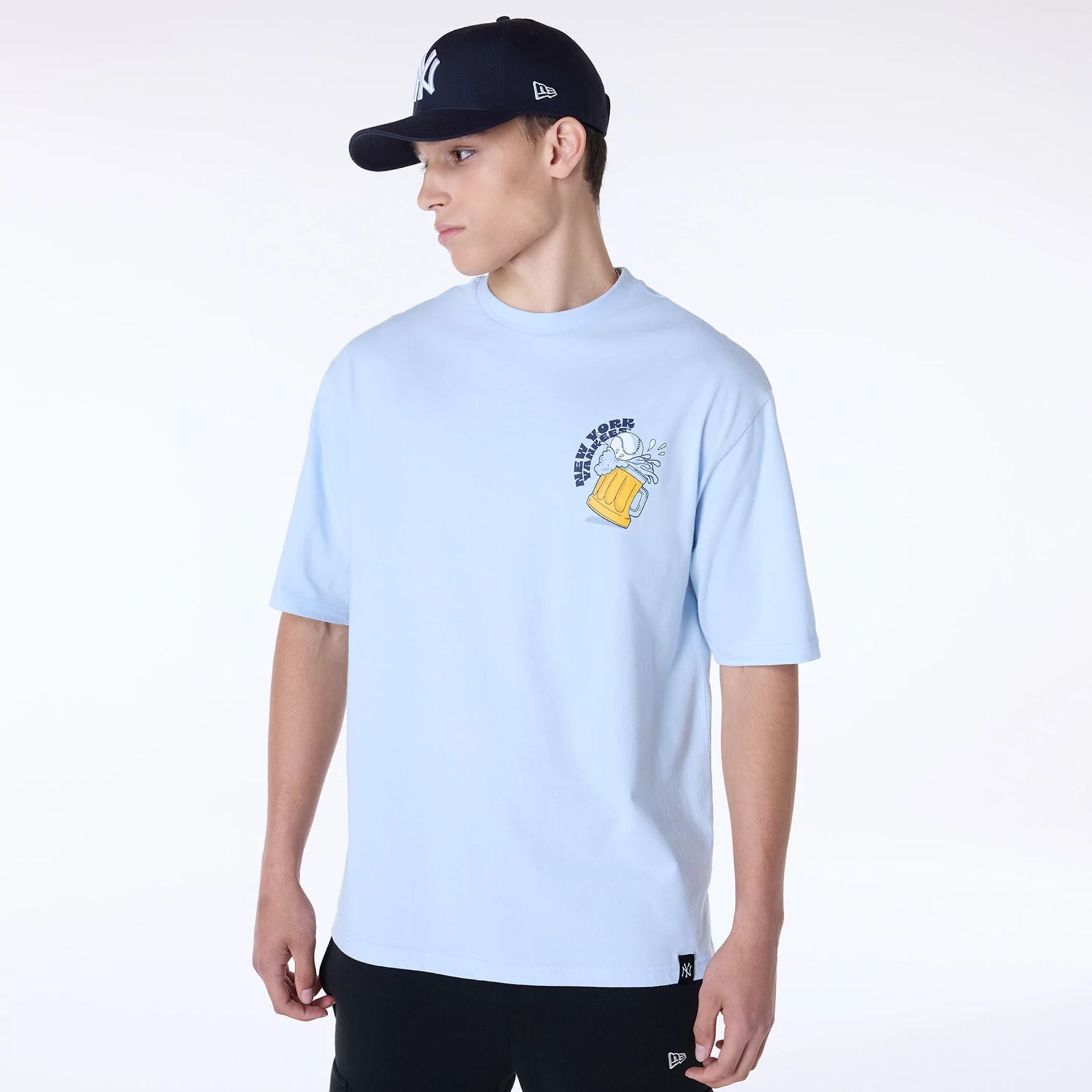 The Male model is wearing New York Yankees MLB Food Graphic Pastel Blue Oversized T-Shirt 1