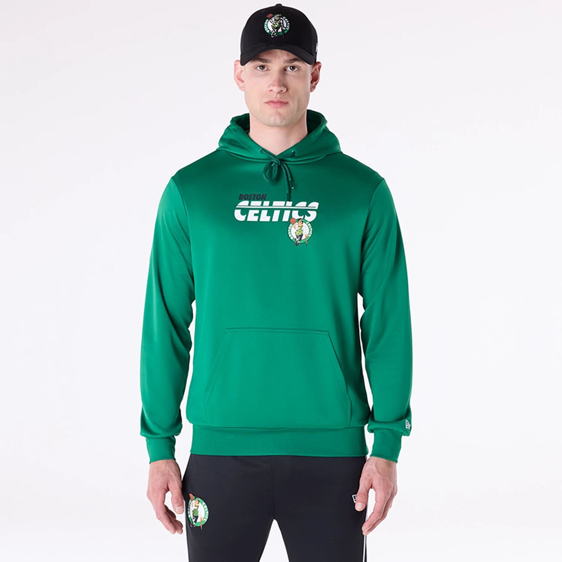 The Male model is wearing Boston Celtics NBA Essentials Green Pullover Hoodie 1