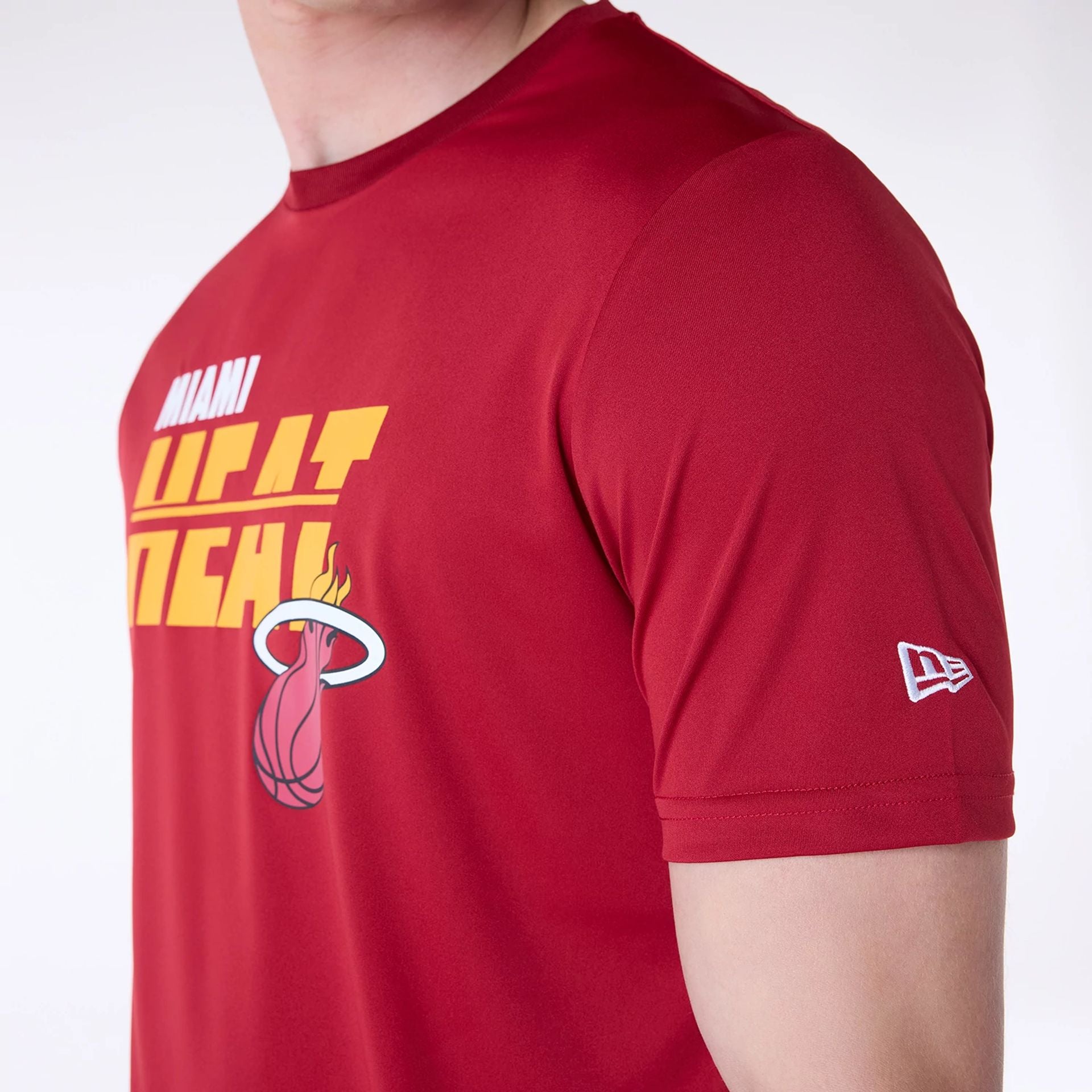 The Male model is wearing Miami Heat NBA Essentials Dark Red T-Shirt 3