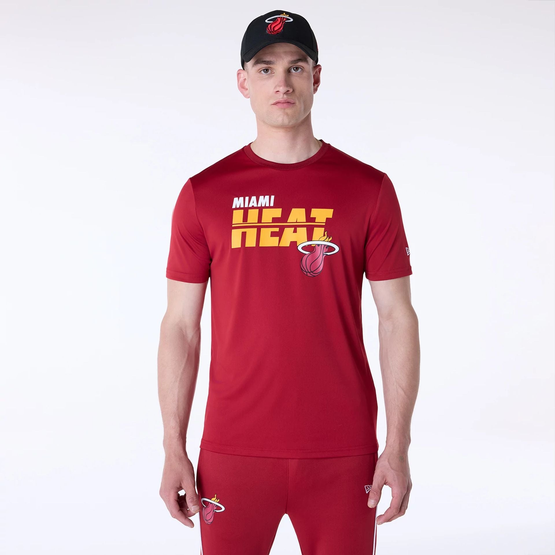 The Male model is wearing Miami Heat NBA Essentials Dark Red T-Shirt 1