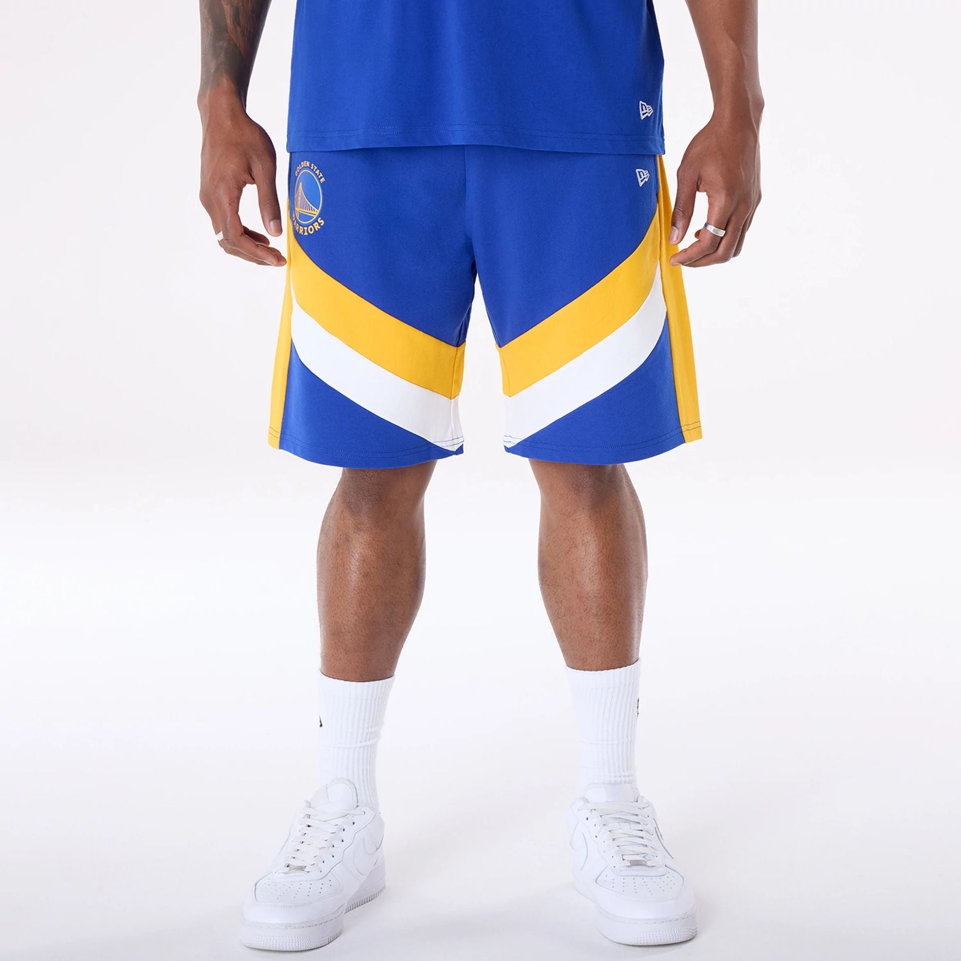 The Male model is wearing Golden State Warriors NBA Panel Blue Shorts 1