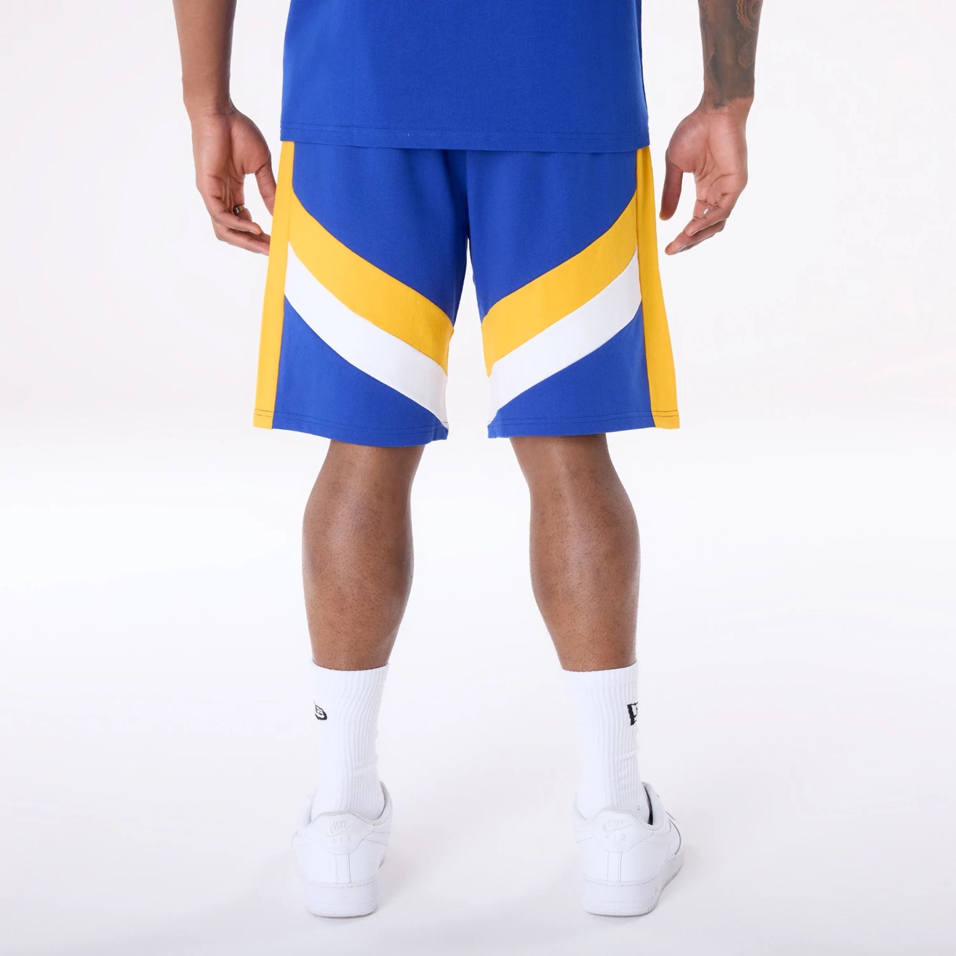 The Male model is wearing Golden State Warriors NBA Panel Blue Shorts 2