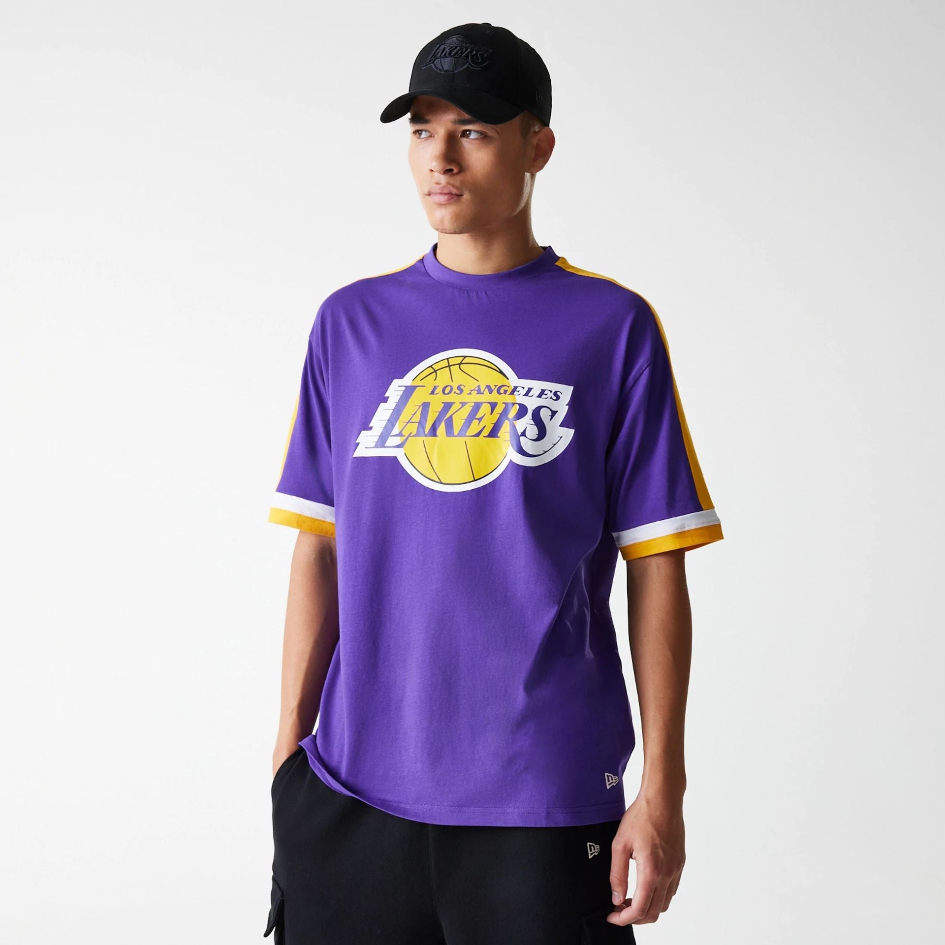 The Male model is wearing LA Lakers NBA Panel Purple Oversized T-Shirt 1