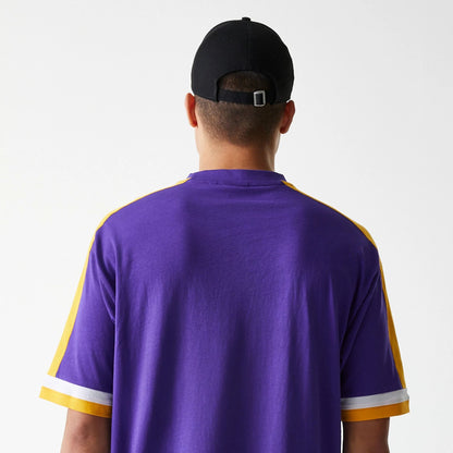 The Male model is wearing LA Lakers NBA Panel Purple Oversized T-Shirt 3