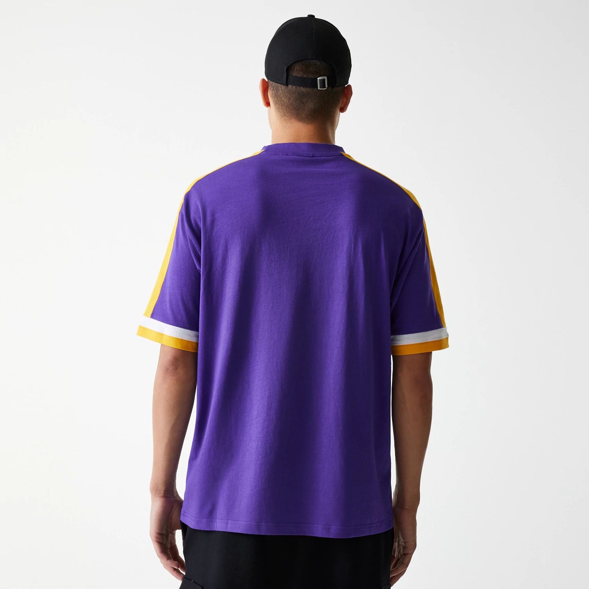 The Male model is wearing LA Lakers NBA Panel Purple Oversized T-Shirt 2