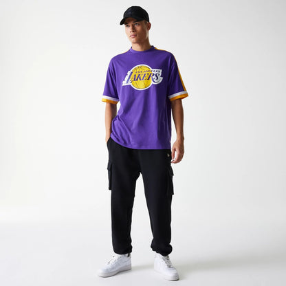 The Male model is wearing LA Lakers NBA Panel Purple Oversized T-Shirt 7