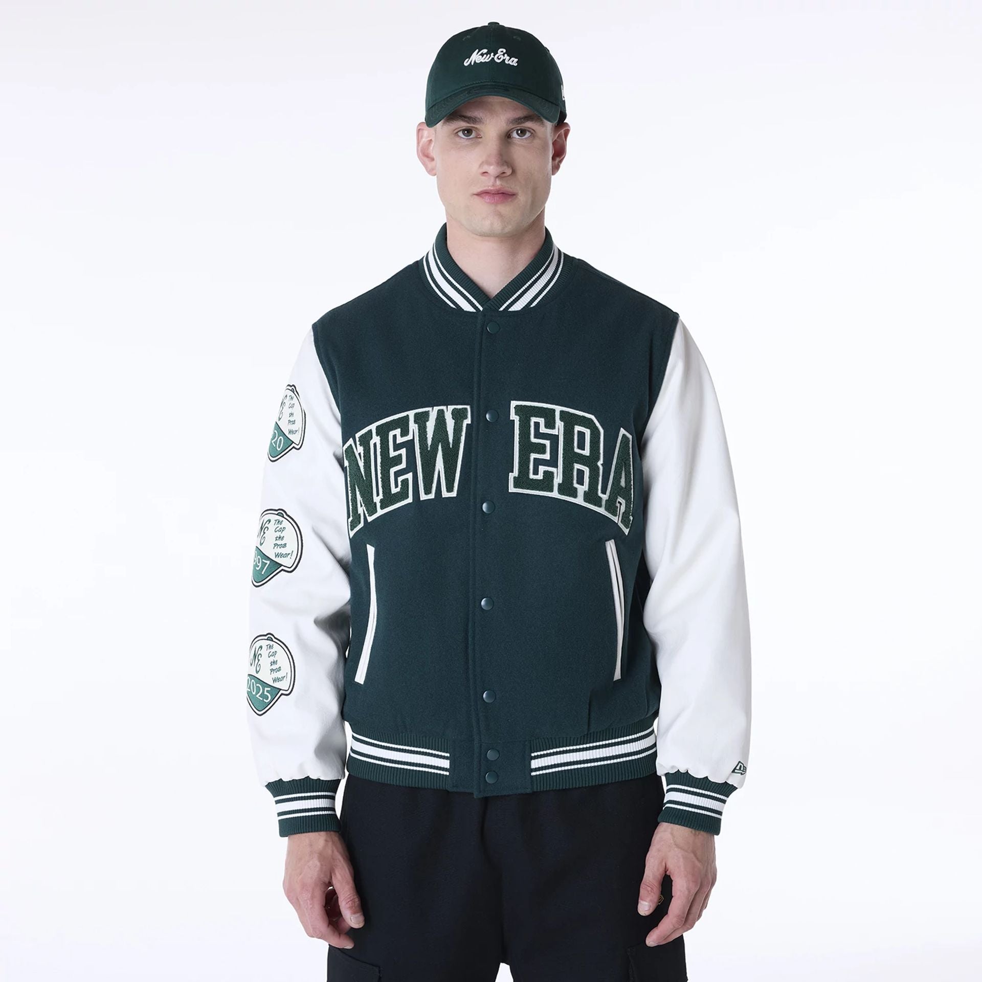 The Male model is wearing New Era Patch Dark Green Varsity Jacket 1