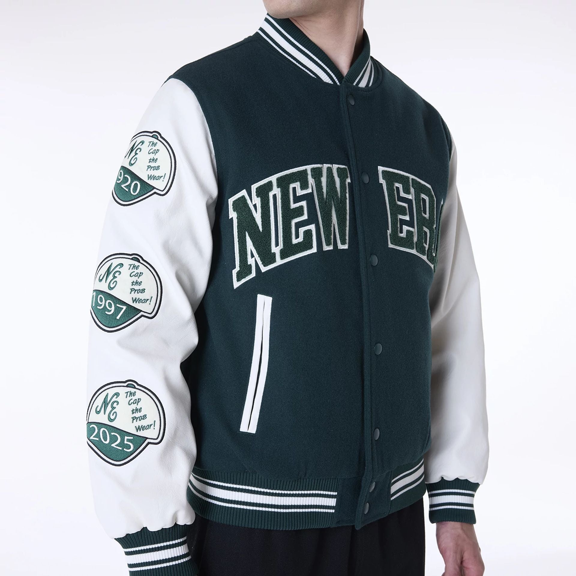 The Male model is wearing New Era Patch Dark Green Varsity Jacket 3