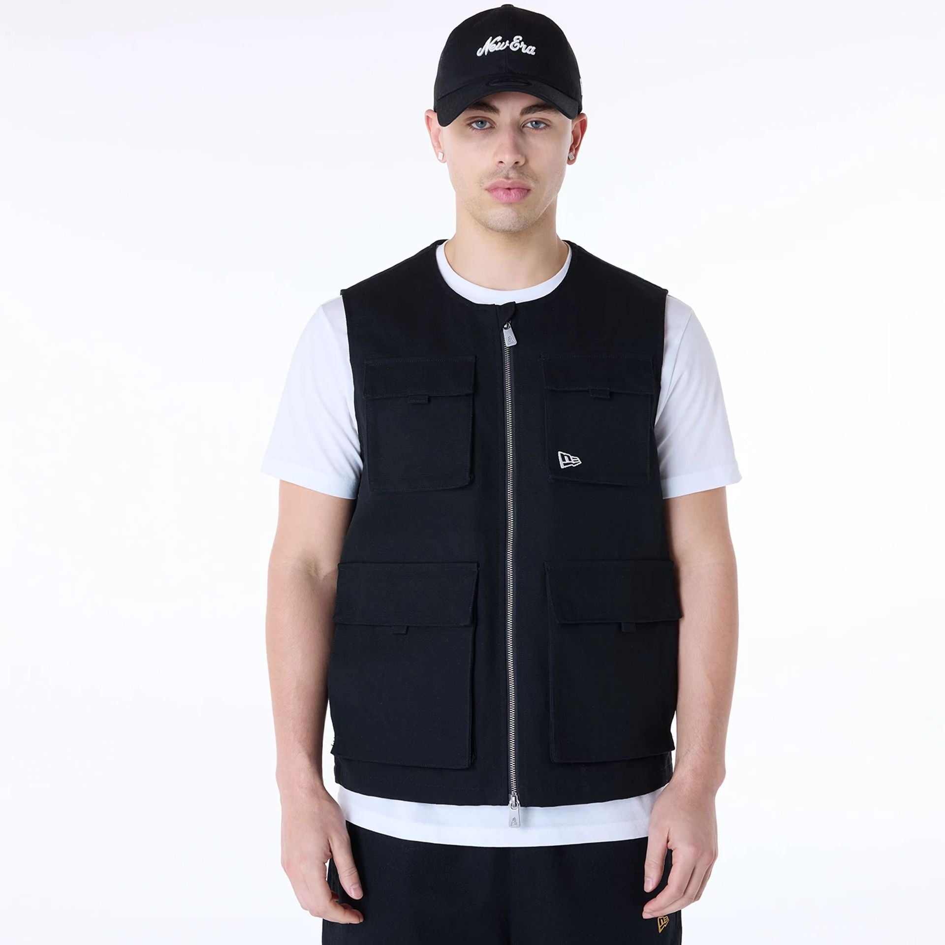 The Male model is wearing New Era Essential Black Utility Vest 3