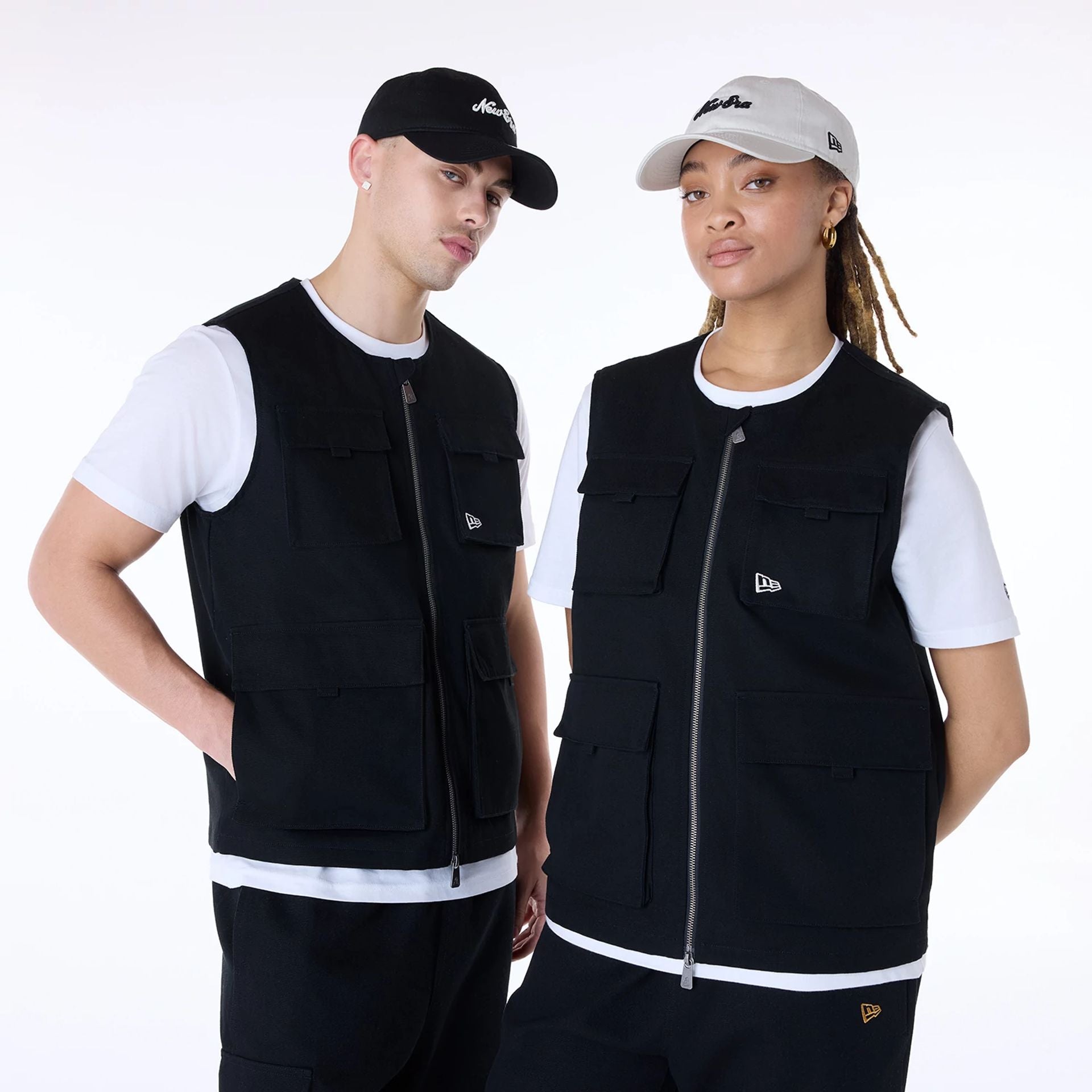 The Male model is wearing New Era Essential Black Utility Vest 1