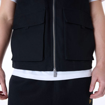 The Male model is wearing New Era Essential Black Utility Vest 7