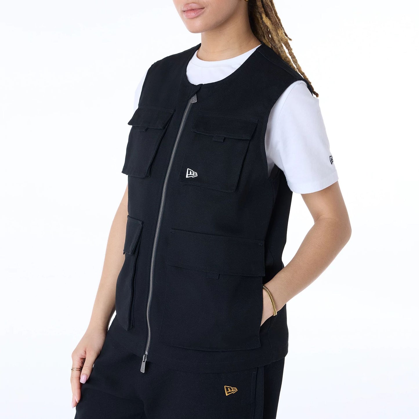 The Male model is wearing New Era Essential Black Utility Vest 5