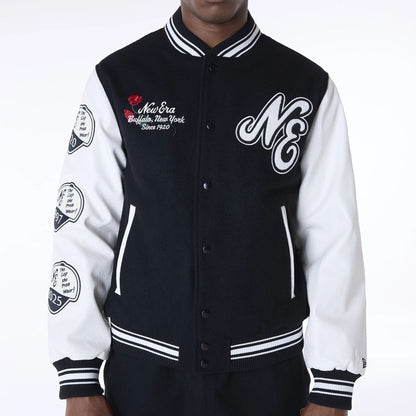 The Male model is wearing New Era Essential Black Varsity Jacket 6