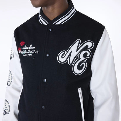 The Male model is wearing New Era Essential Black Varsity Jacket 7