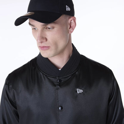 The Male model is wearing New Era Essential Black Satin Bomber Jacket 3