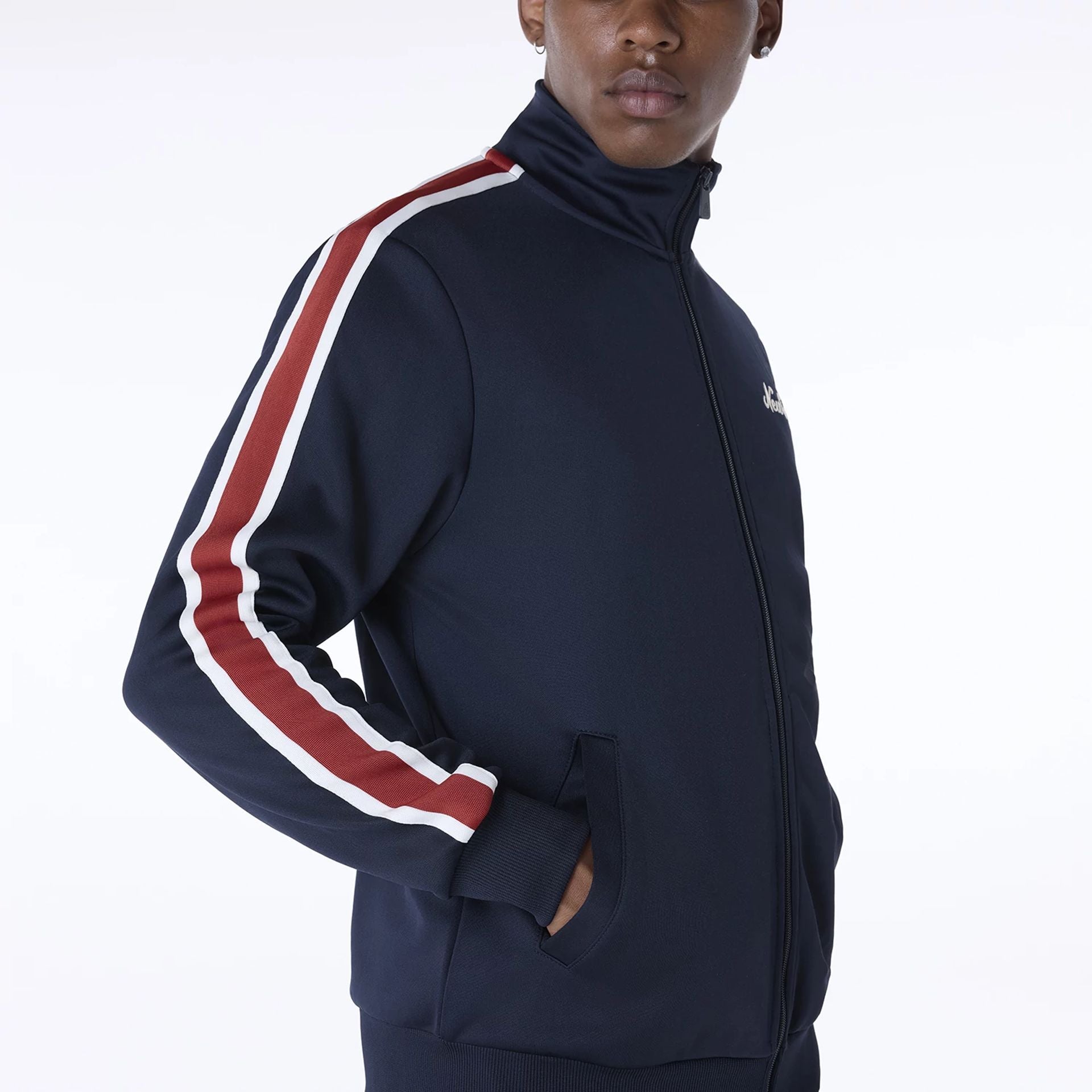 The Male model is wearing New Era Essential Navy Track Jacket 5