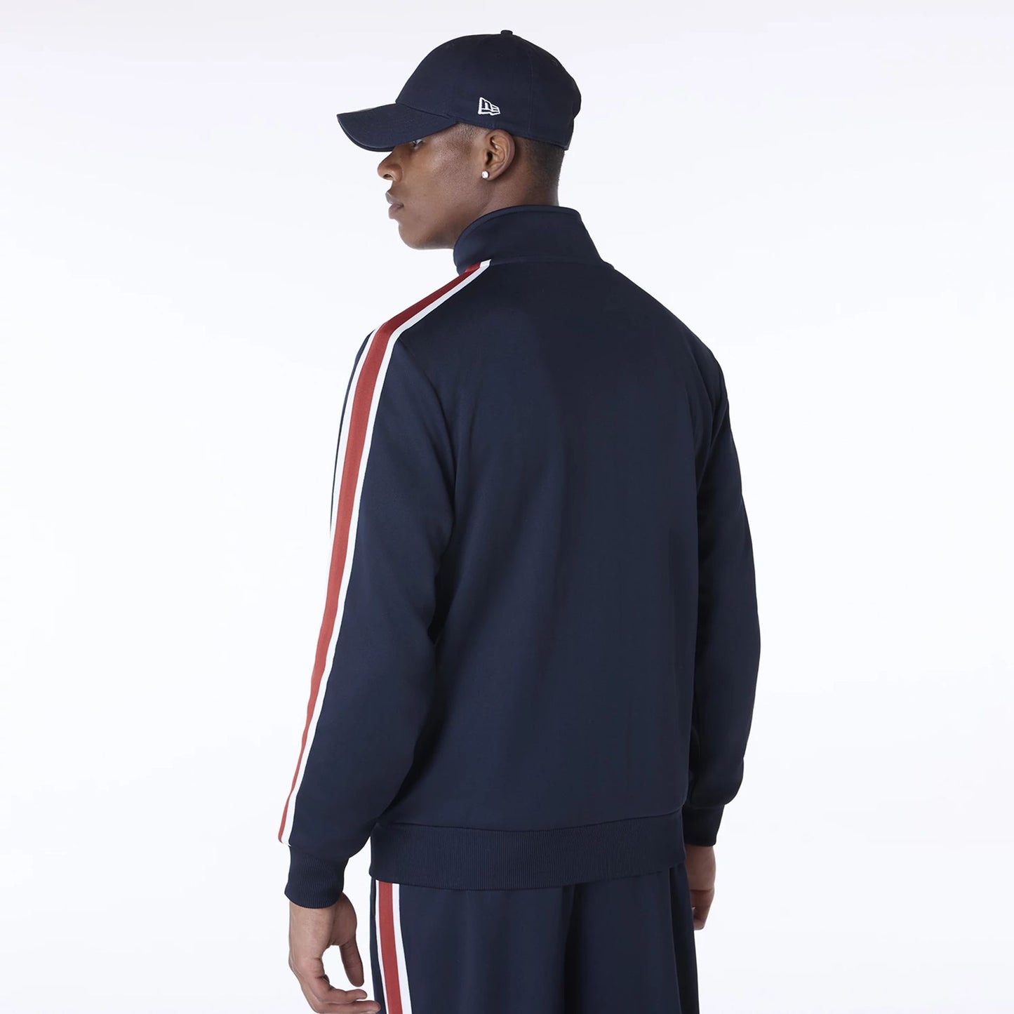 The Male model is wearing New Era Essential Navy Track Jacket 6