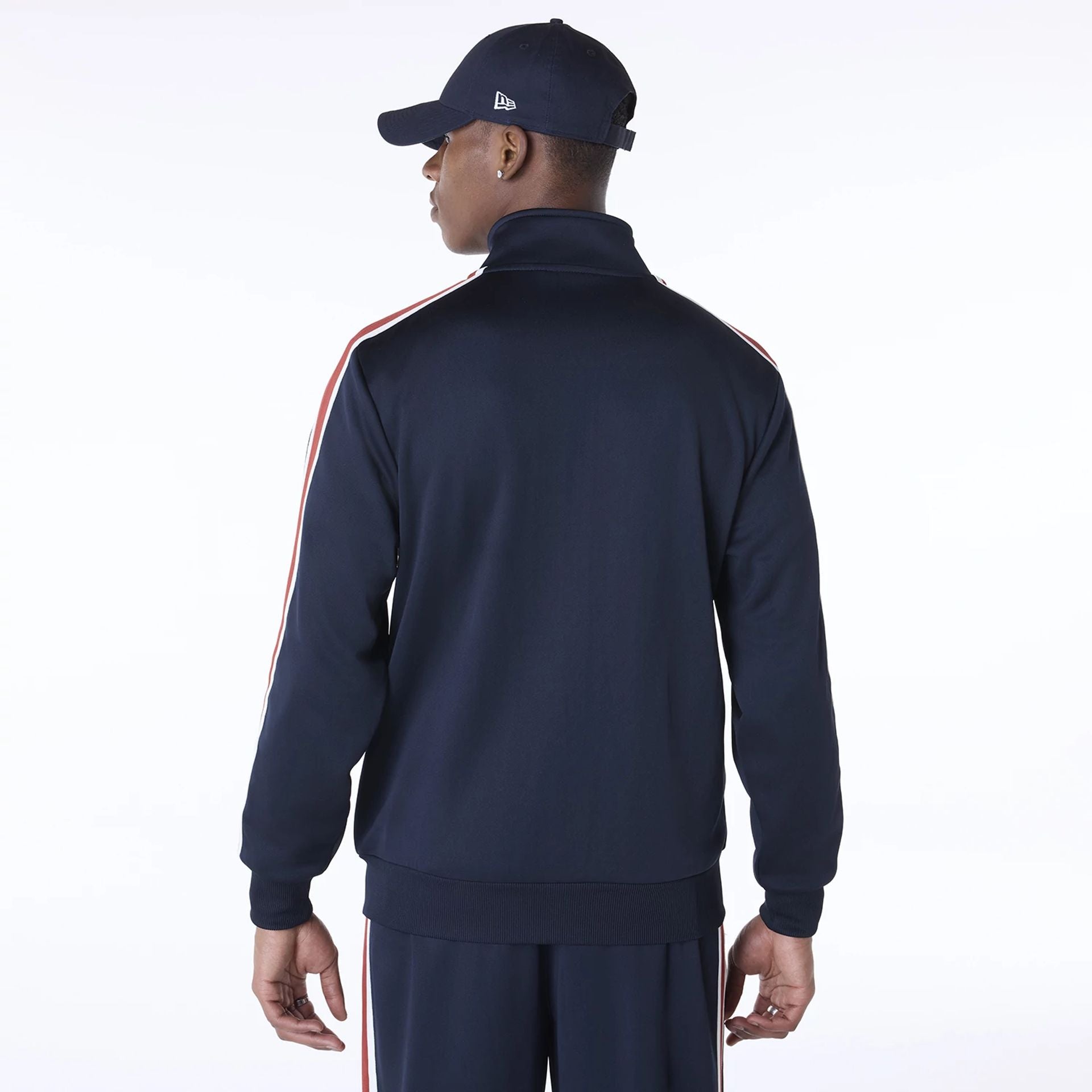 The Male model is wearing New Era Essential Navy Track Jacket 2