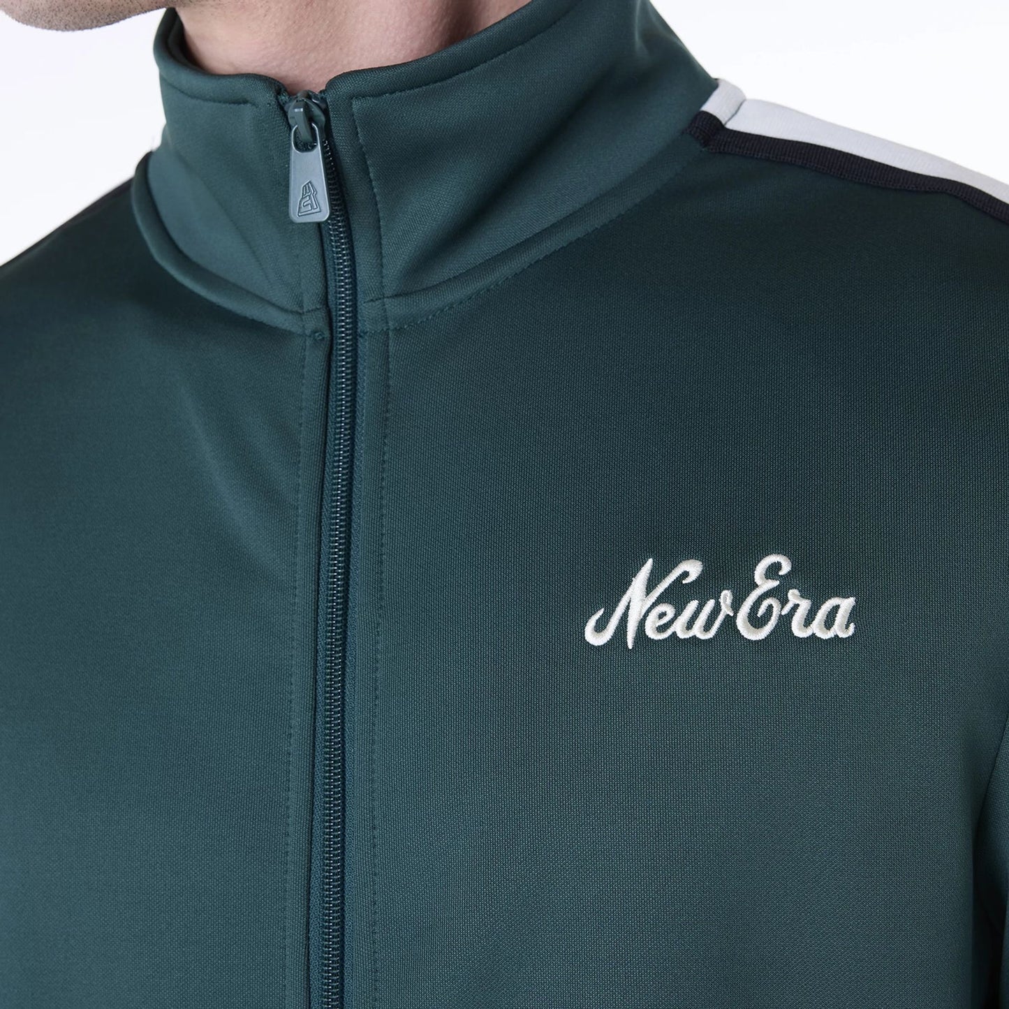 The Male model is wearing New Era Essential Dark Green Track Jacket 8