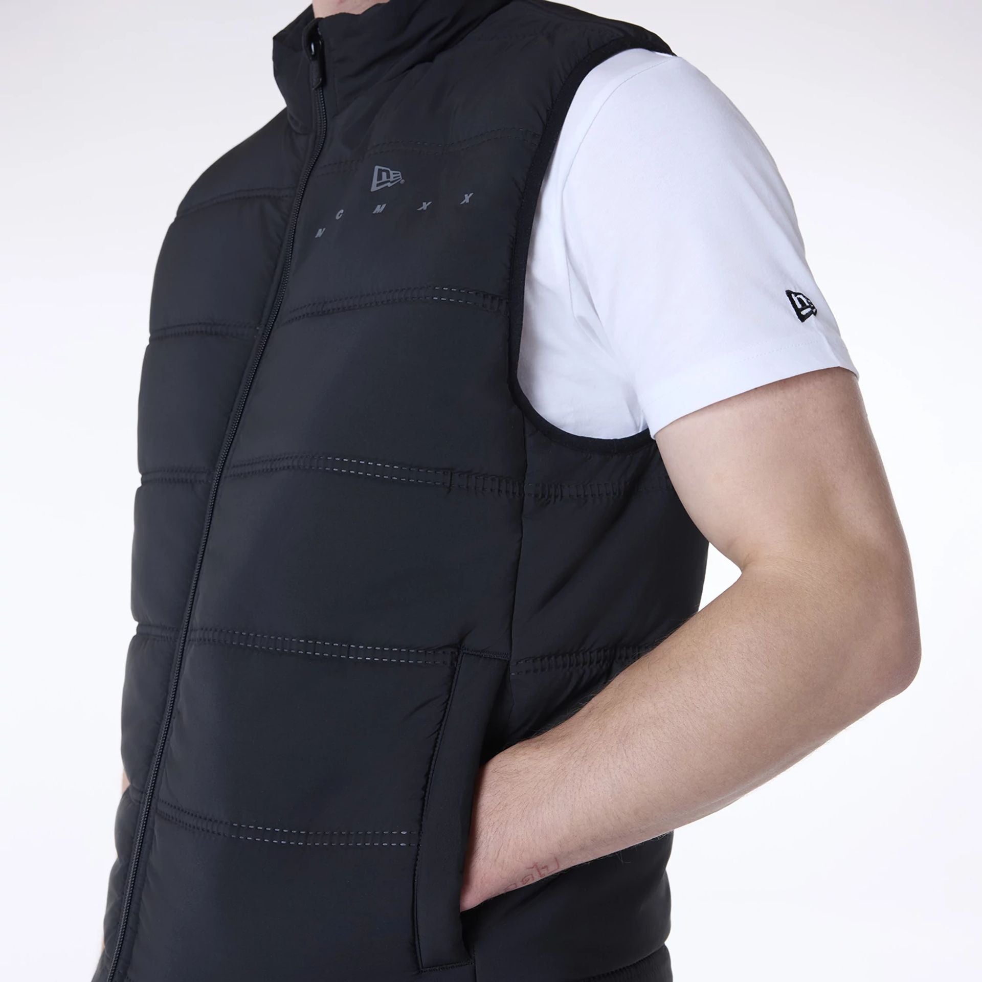 The Male model is wearing New Era Essential Black Padded Gilet 3