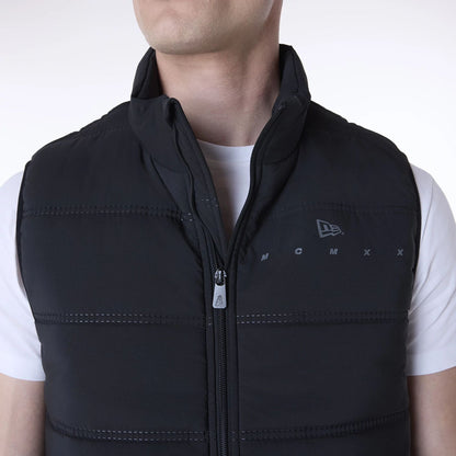 The Male model is wearing New Era Essential Black Padded Gilet 4