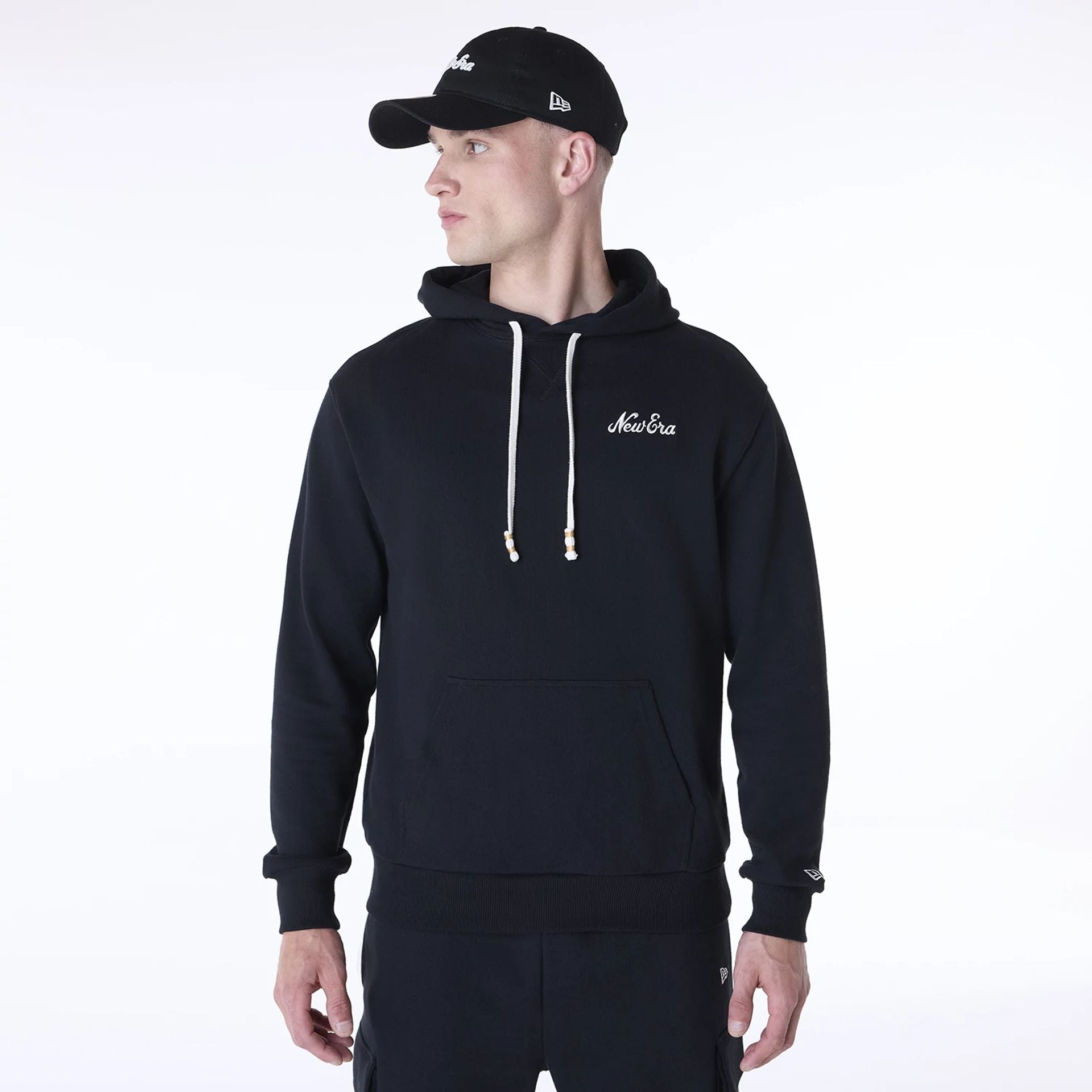 The Male model is wearing New Era Script Black Pullover Hoodie 1