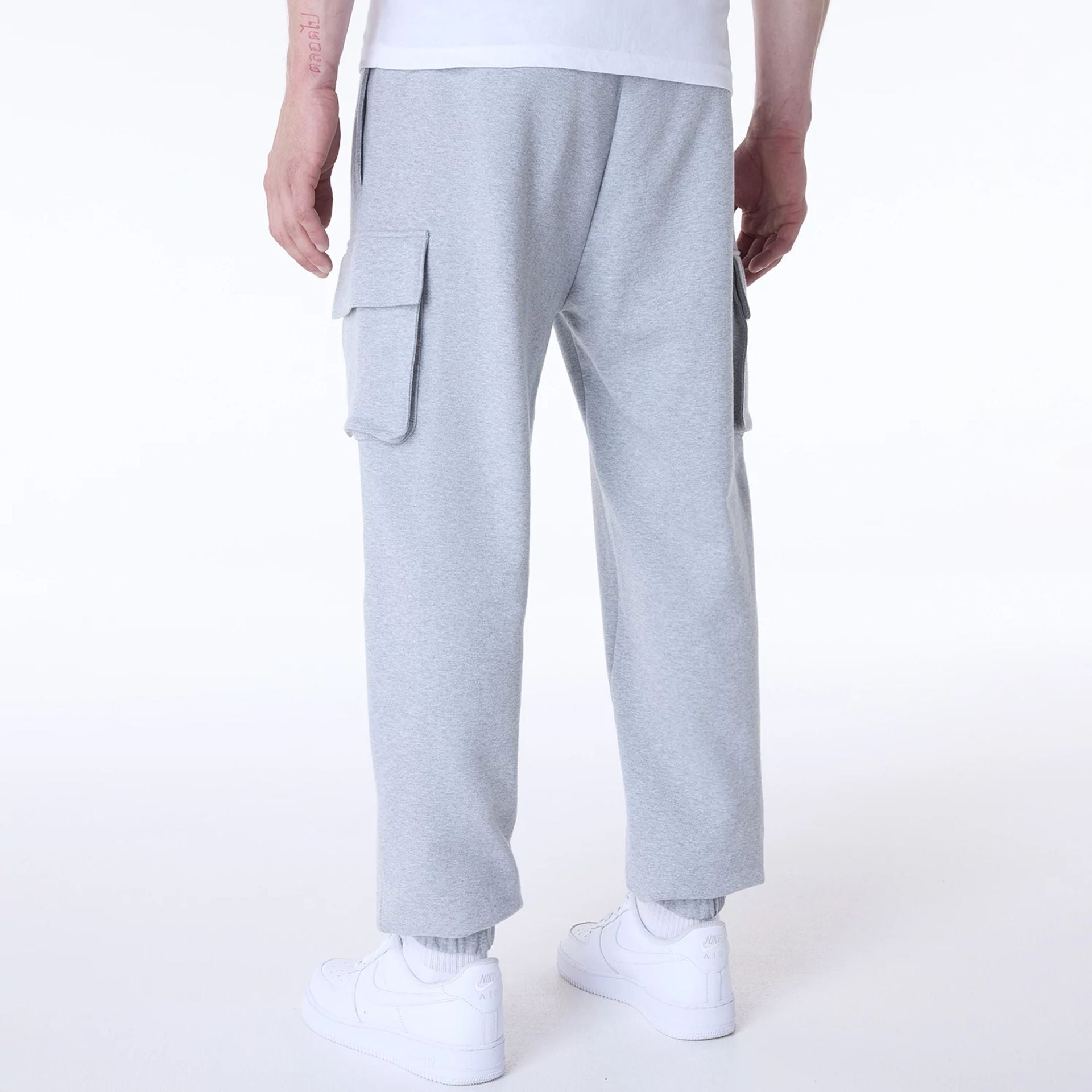 The Male model is wearing New Era Script Grey Fleece Joggers 2