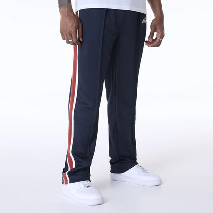 The Male model is wearing New Era Essential Navy Track Pants 3