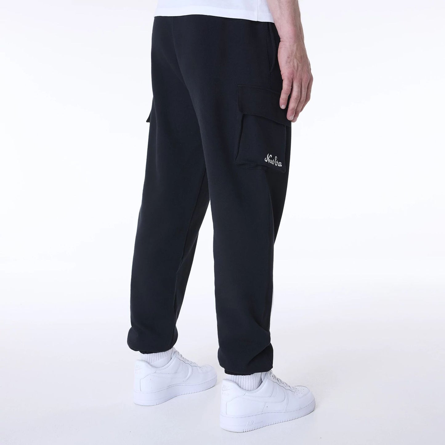 The Male model is wearing New Era Script Black Fleece Joggers 3