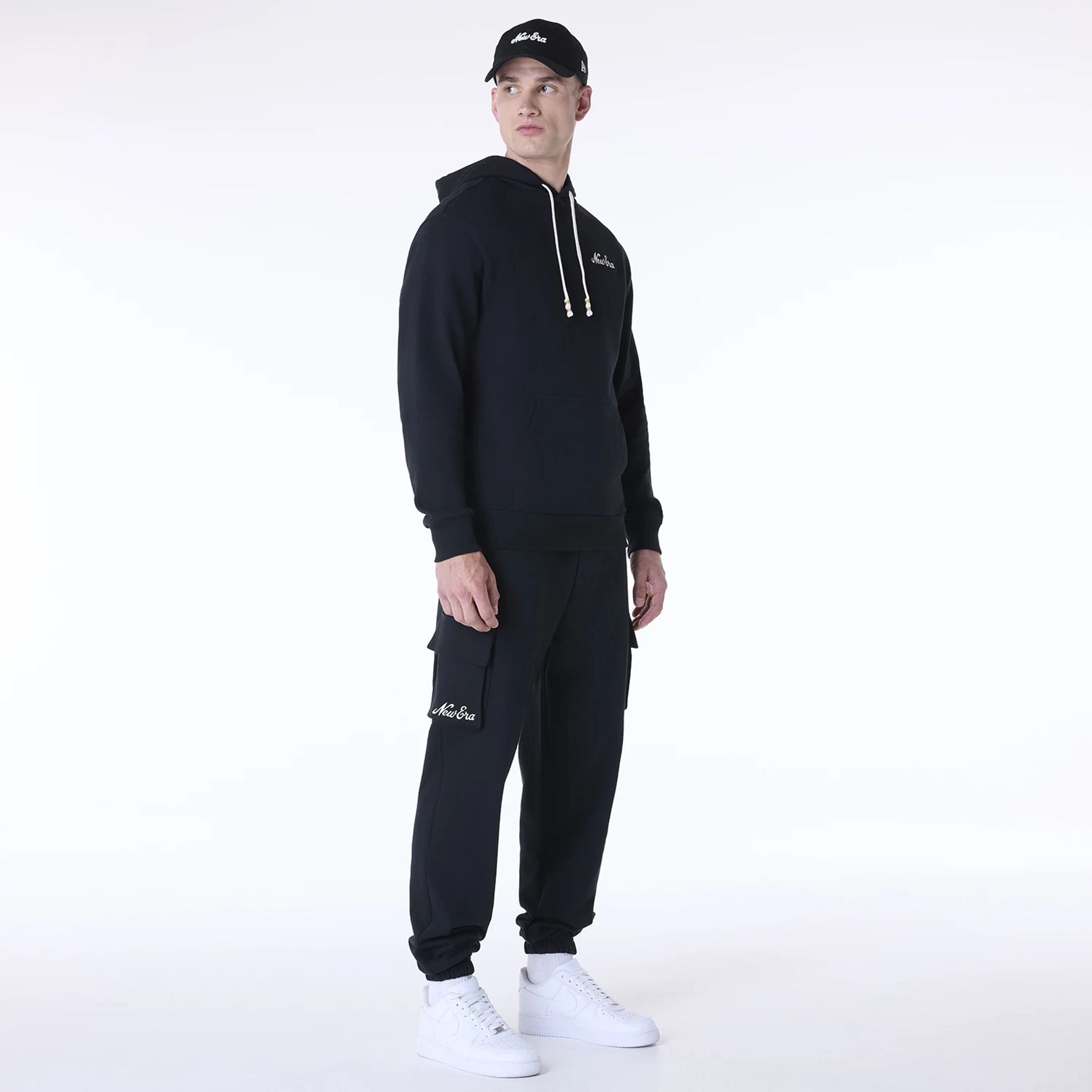 The Male model is wearing New Era Script Black Fleece Joggers 8