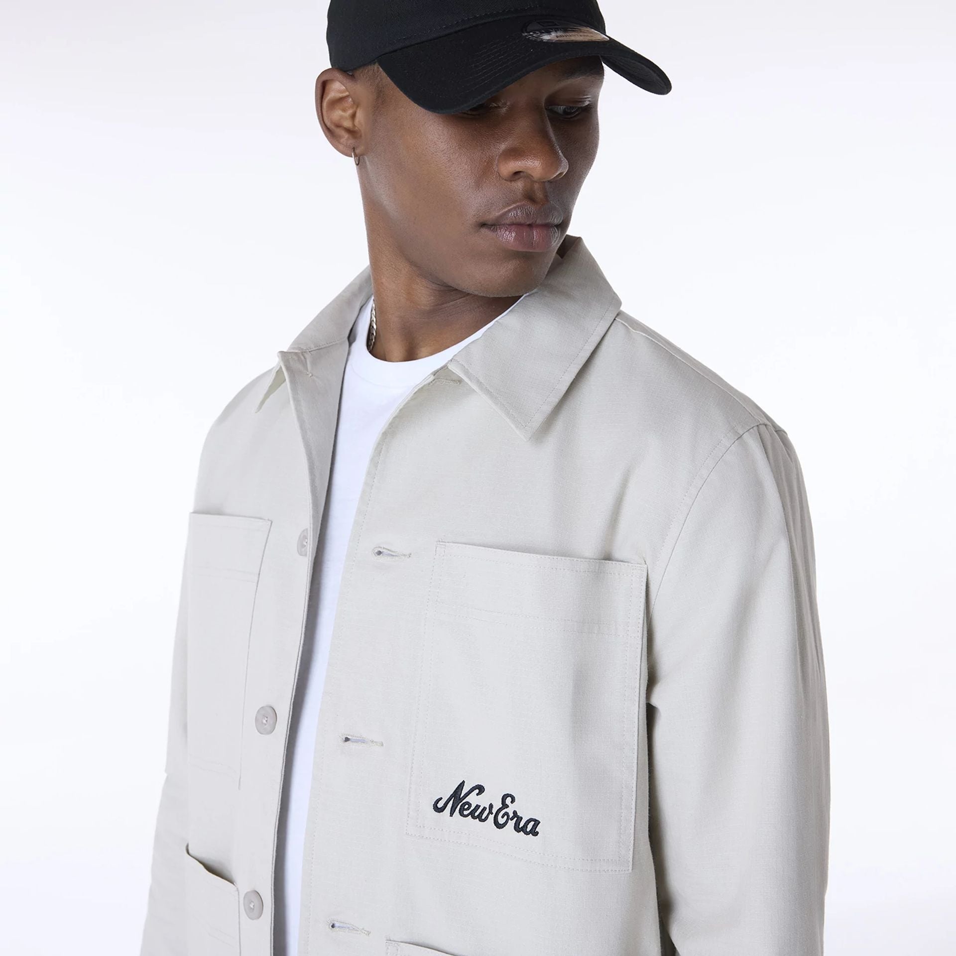 The Male model is wearing New Era Essential Cream Shacket 4