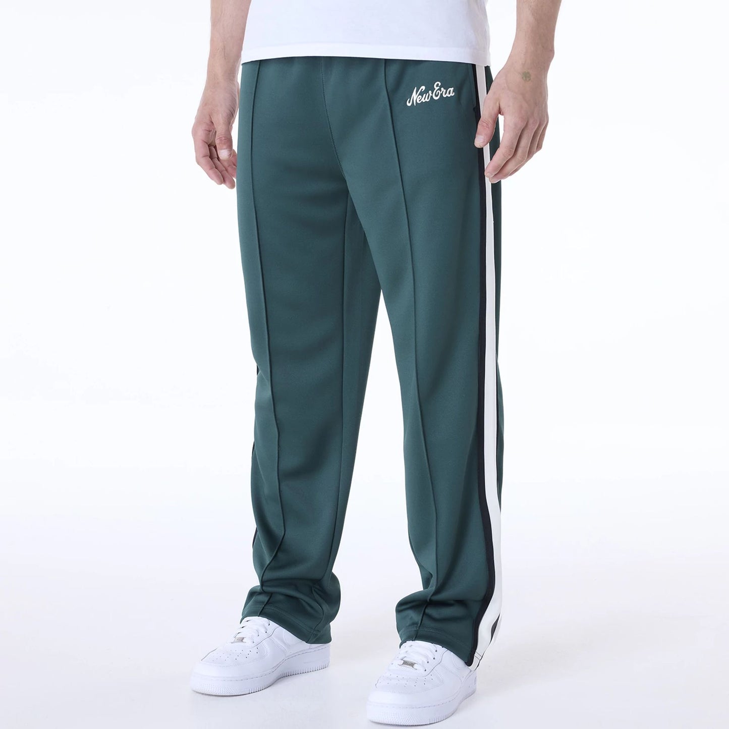 The Male model is wearing New Era Essential Dark Green Track Pants 7