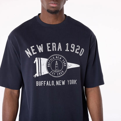 The Male model is wearing New Era Graphic Navy Oversized T-Shirt 5