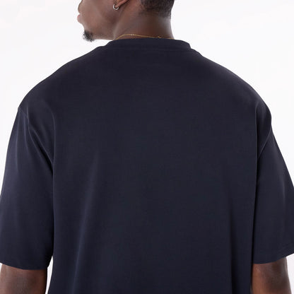 The Male model is wearing New Era Graphic Navy Oversized T-Shirt 4