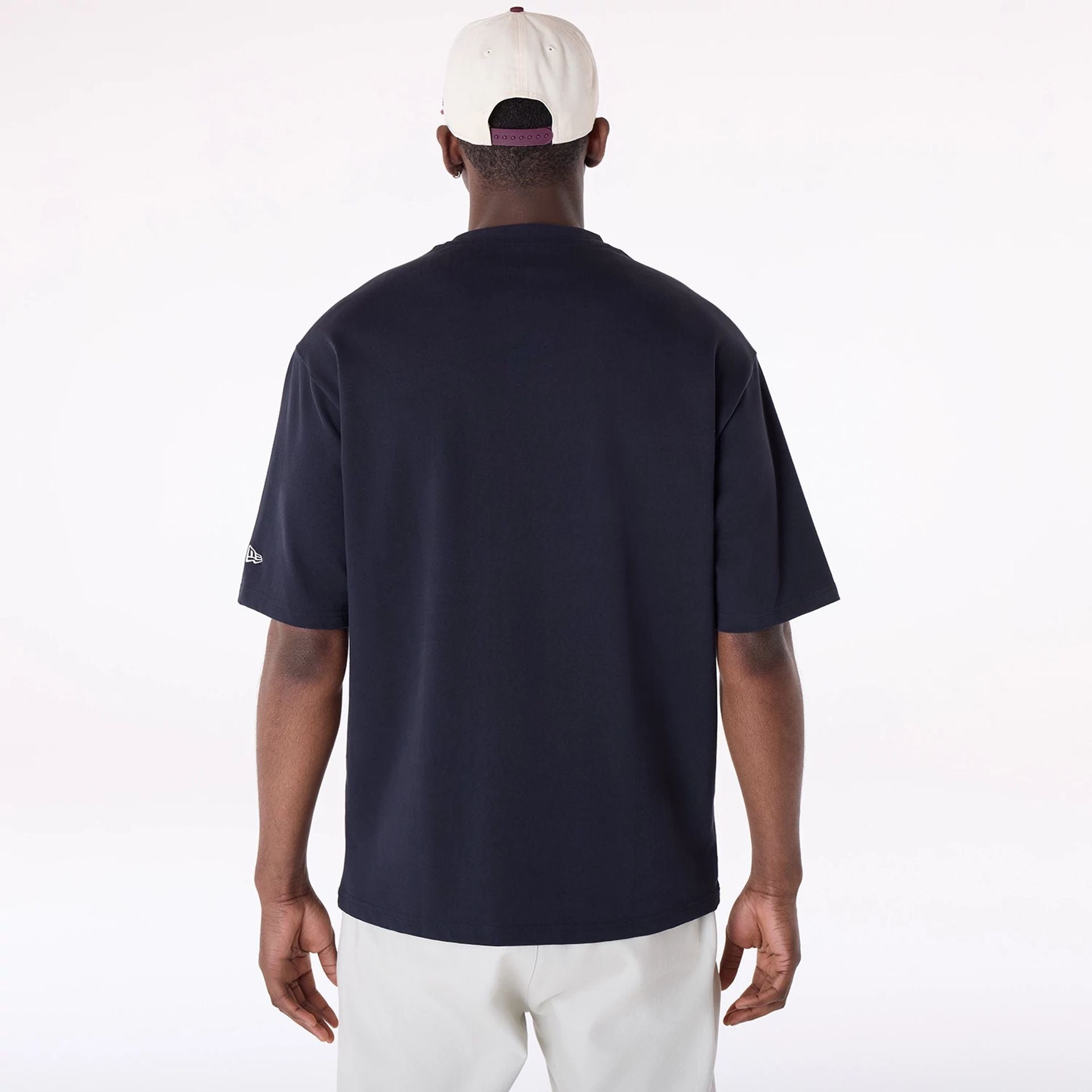 The Male model is wearing New Era Graphic Navy Oversized T-Shirt 2