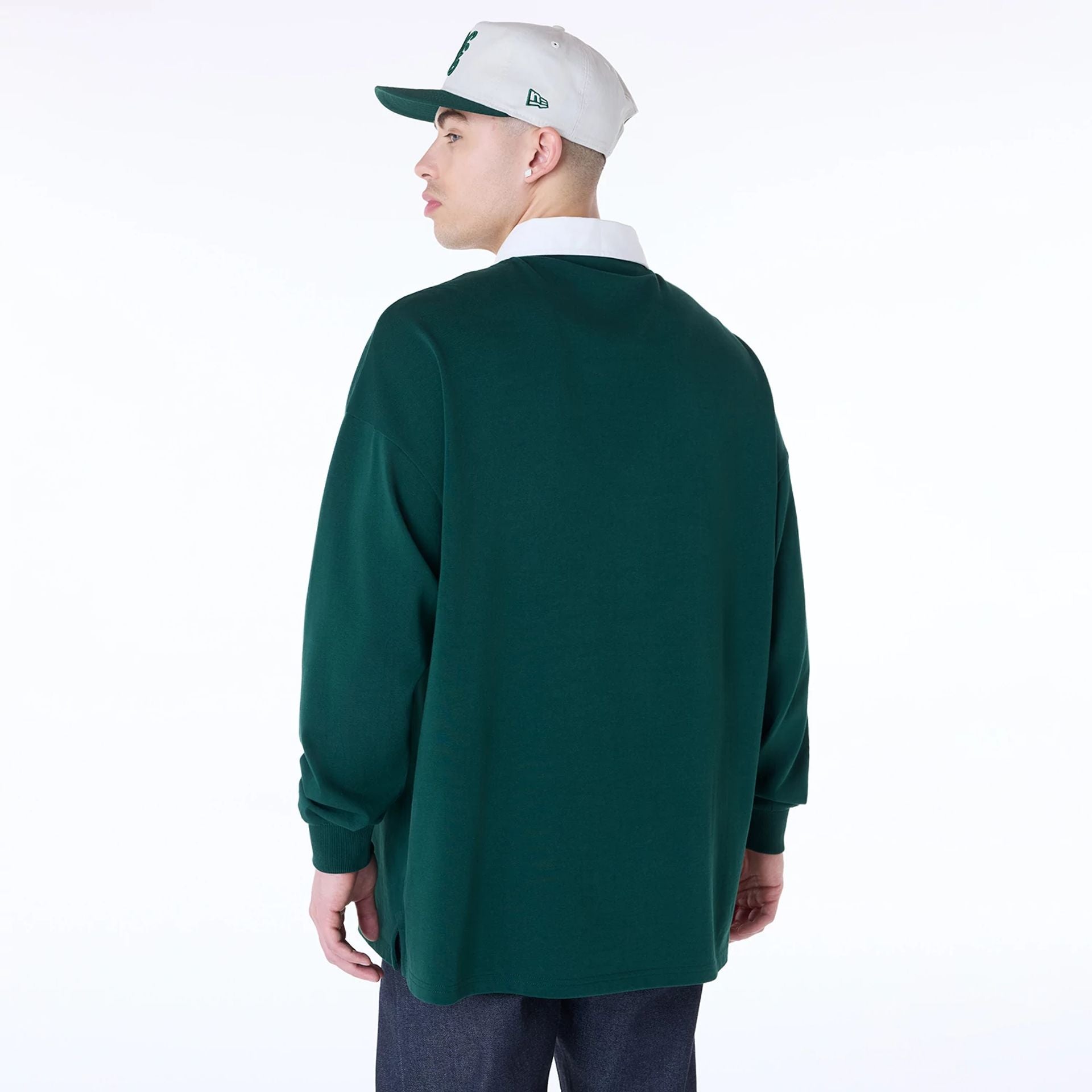 The Male model is wearing New Era Drop Shoulder Dark Green Rugby 2