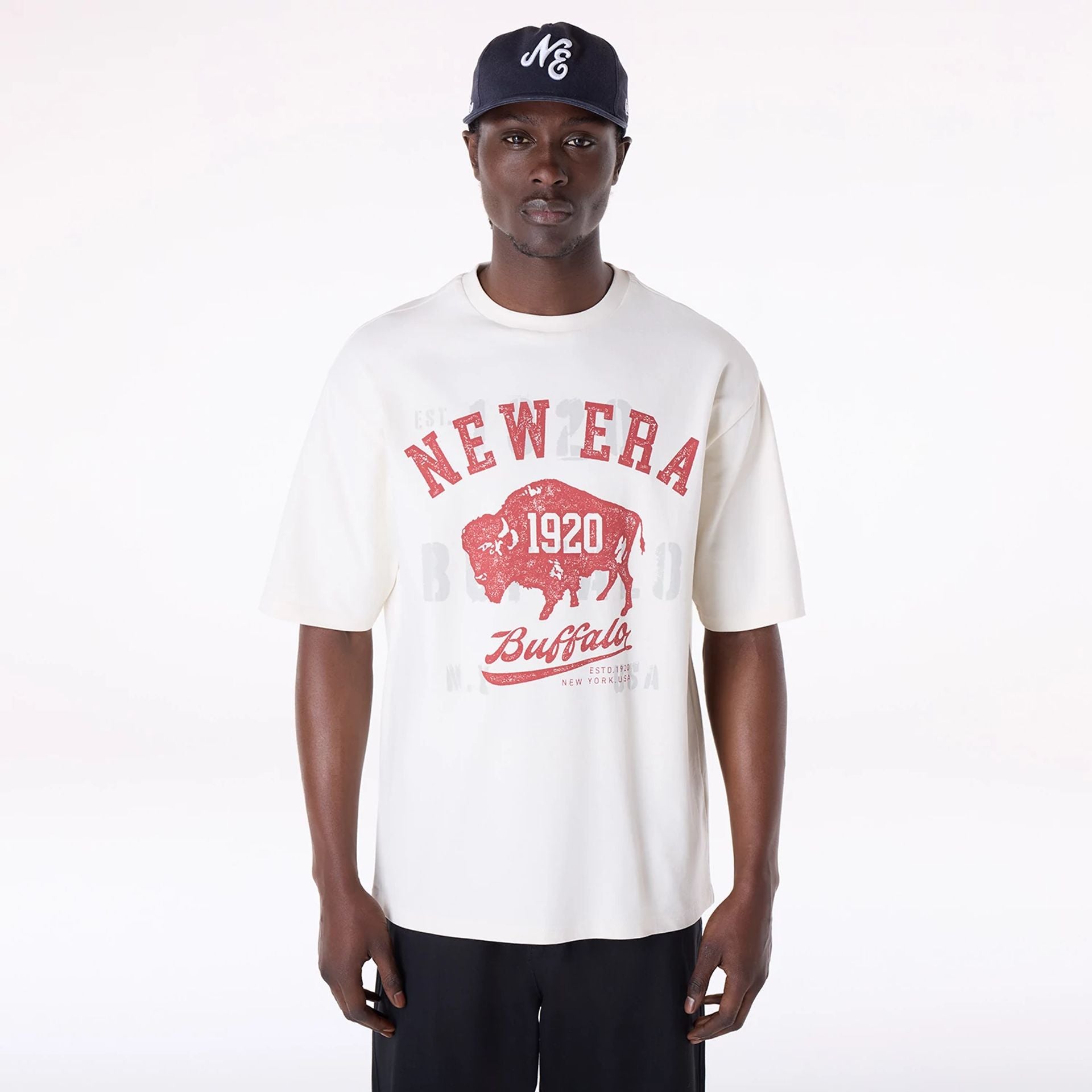 The Male model is wearing New Era Graphic Open White Oversized T-Shirt 1