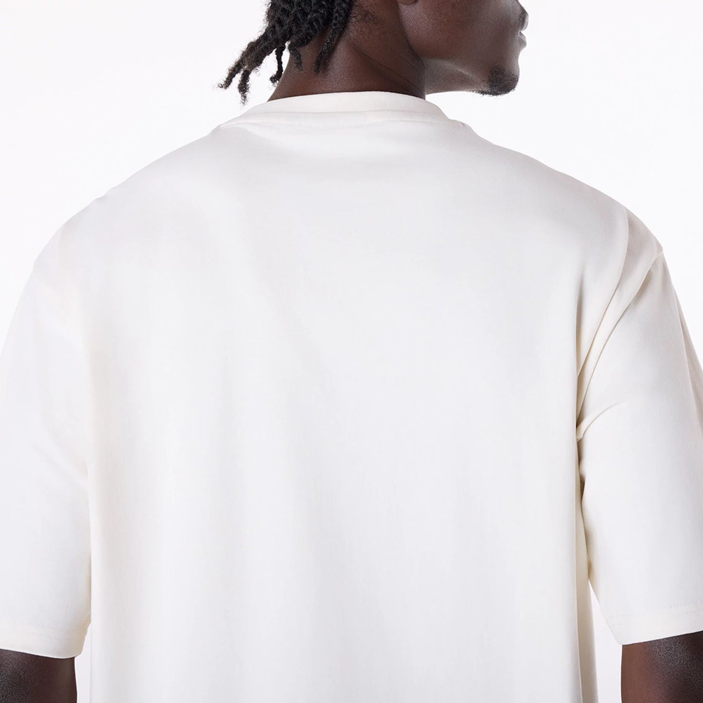 The Male model is wearing New Era Graphic Open White Oversized T-Shirt 6